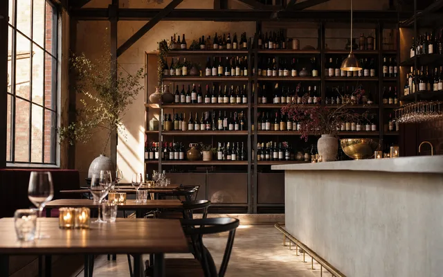 Illustrative wine-bar scene for Gimlet at Cavendish House — not an actual photo of the venue