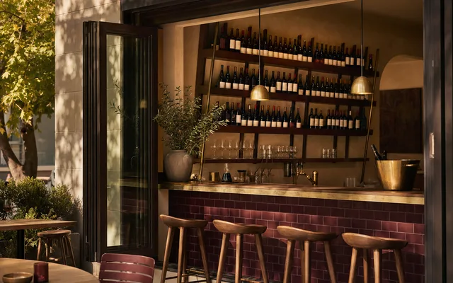 Illustrative wine-bar scene for Italian and Sons — not an actual photo of the venue