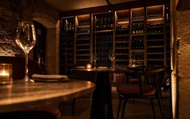 Illustrative wine-bar scene for Wines of While — not an actual photo of the venue